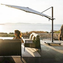 Load image into Gallery viewer, The Jardinico Carectere JCP 303 Square 300cm x 300cm Commercial grade Cantilever Parasol offers a large amount of shade and suitable for everyday use in commercial and hotel setting. The Carectere Cantilever side arm parasol is available with a Black framework and features full Tilt in height, Left to Right Tilt and 360 Degree rotation to ensure you can create a large amount of shade no matter what time of day. 
