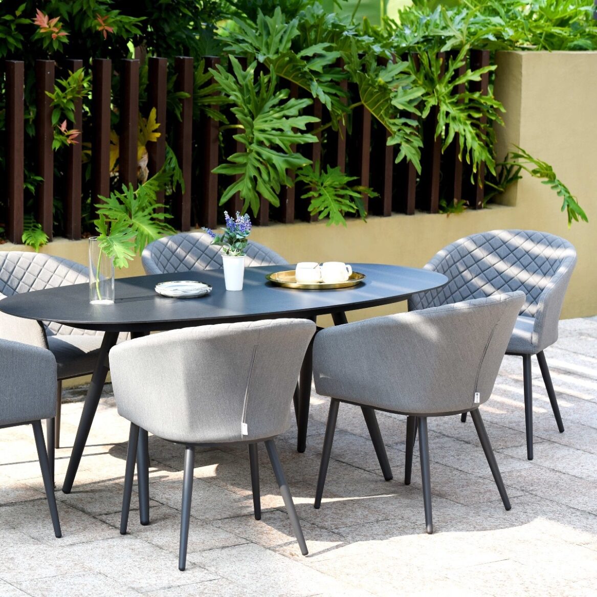 Ambition All Weather Fabric Oval Six seat Garden Dining Set with Spray Stone Dining Table